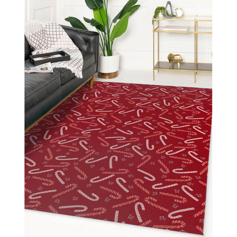 The Twillery Co.® Mukul candy cane kisses red area rug by The